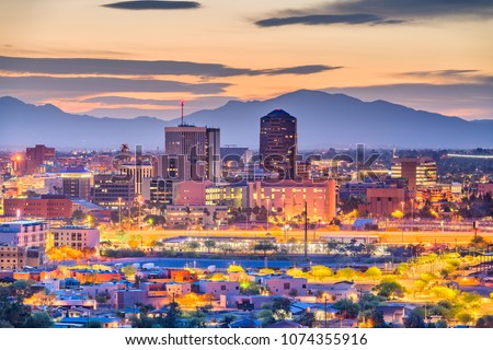 Tucson, Arizona, USA downtown skyline with Sentinel Peak at dusk.