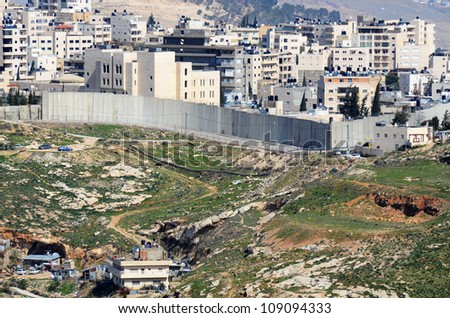 The Israel West Bank Barrier, a symbol of the ongoing conflict between Israel and Palestine.