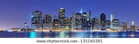 New York City panorama with the Brooklyn Bridge and the Financial district from across the East River.