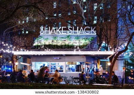 NEW YORK CITY - APRIL 15: Customers dine at Shake Shack in Madison Square Park April 15, 2013 in New York, NY. The chain diner opened in 2004 and the Madison Square Park location is the original.