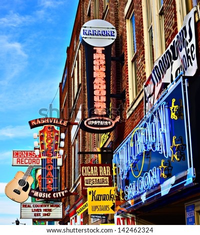 NASHVILLE JUNE 16 Honky-tonks on Lower Broadway June 16 2013 in Nashville Tennessee The district is famous for the numerous country music entertainment establishments NASHVILLE JUNE 16 Honky-tonks on Lower Broadway June 16 2013 in Nashville Tennessee The district is famous for the numerous country music entertainment establishments