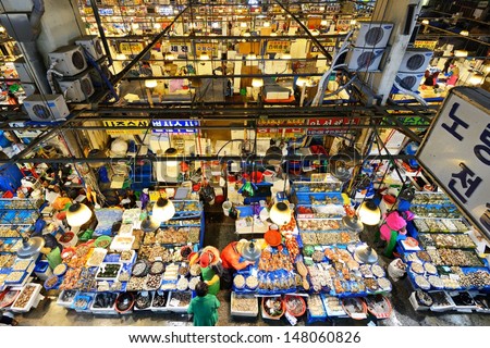 Seoul - February 18: Aerial View Of Shoppers At Noryangjin Fisheries Wholesale Market February 18, 2013 In Seoul, South Korea. The 24 Hour Market Has Over 700 Stalls Selling Fresh And Dried Seafood.