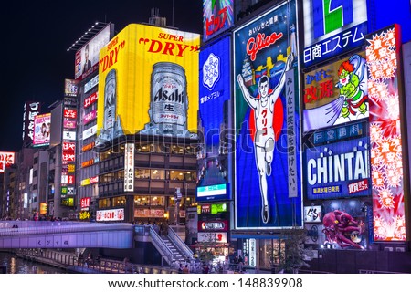 Osaka - November 25: The Famed Advertisements Of Dotonbori On November 25, 2012 In Osaka, Japan. With A History Reaching Back To 1612, The Districtis Now One Of Osaka\'S Primary Tourist Destinations.