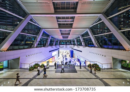 HONG KONG - OCTOBER 9, 2012: Pedestrians pass through the International Commerce Building public lobby. The building is the tallest in the city.