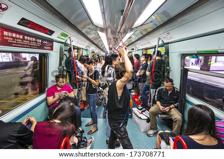 HONG KONG, CHINA - OCTOBER 14, 2012: Passengers ride the subway in Hong Kong. The MTR consists of 218.2 km of rail with 152 stations.
