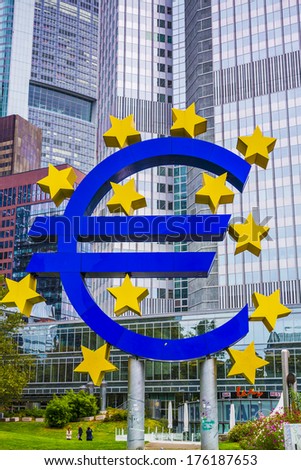 FRANKFURT - OCTOBER 4, 2013: The Euro Sign in Frankfurt, Germany. The sign is part of Eurotower which serves as the seat of the European Central Bank.