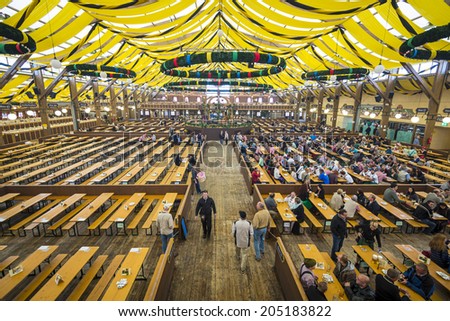 MUNICH, GERMANY - SEPTEMBER 30, 2013: The Paulner Beer Tent on the Theresienwiese Oktoberfest fair grounds. The 16 day festival has been annually celebrating beer since 1810.