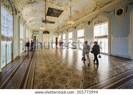 SAINT PETERSBURG, RUSSIA - SEPTEMBER 8, 2013: Visitors tour the Hermitage Museum. Founded in 1764, it is one of the oldest museums in the world.