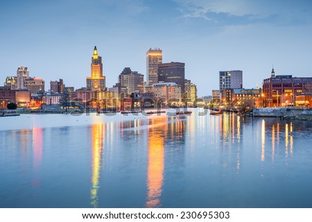 Providence, Rhode Island, USA city skyline on the Providence River at twilight.