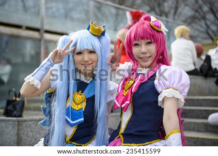 TOKYO, JAPAN - MARCH 23, 2014: Girls dressed as anime characters pose at a cosplay gathering.