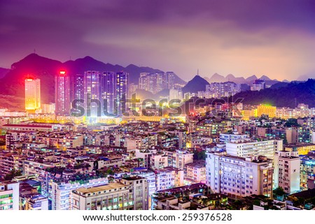 Guiyang, China downtown cityscape and Karst mountains.