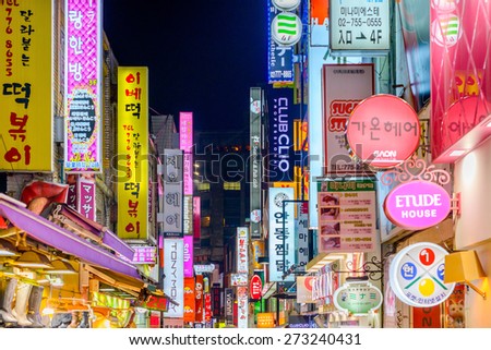 SEOUL - FEBRUARY 14, 2013: The neon lights of Myeong-Dong. The location is the premiere district for shopping in the city.