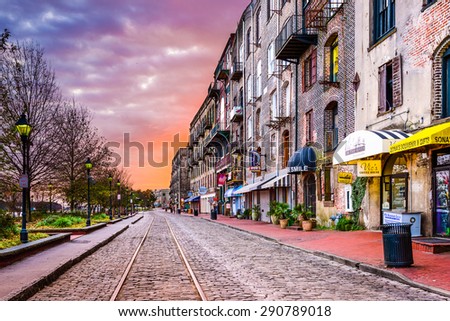 SAVANNAH, GEORGIA - JANUARY 10, 2015: Shops and restaurants line River Street. The historic street is the center of nightlife in the city.