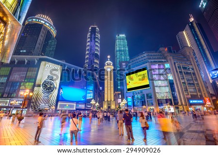 CHONGQING, CHINA - JUNE 1, 2014: People stroll through the Jiefangbei CBD pedestrian mall. The district is considered the most prominent financial district in the interior of China.