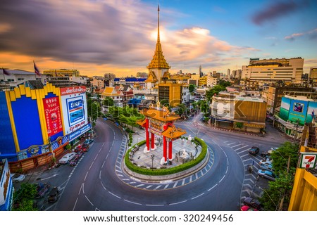 BANGKOK, THAILAND - SEPTEMBER 23, 2015: The Chinatown traffic circle with Wat Traimit behind.