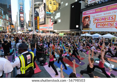 NEW YORK CITY - JUNE 21: A public yoga event in Times Square June 21, 2010 in New York, New York.