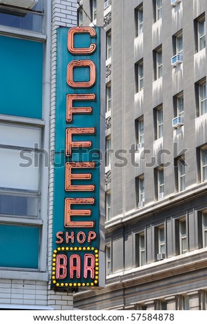 Retro diner sign in the city saying \