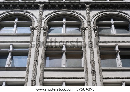 Ornate windows on New York City apartments.