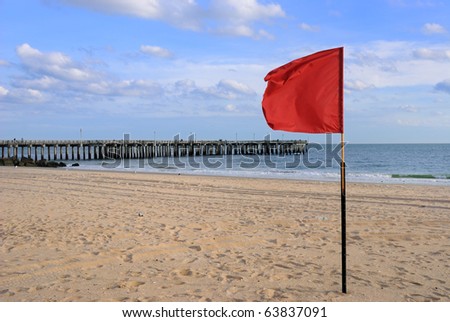 Red flag at the beach in coney island new york city warning beach goers the water is off limits.
