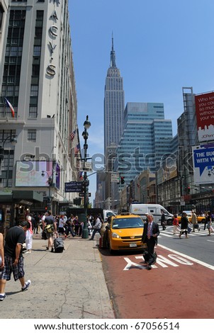 NEW YORK CITY - MAY 25: Intersection of the historic Fashion Avenue and 34th Street with the Empire State Building and Macy\'s in View May 25, 2010 in New York, NY.