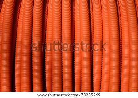 coiled orange tubing background textures