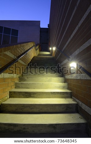 An exterior stair case with lighting