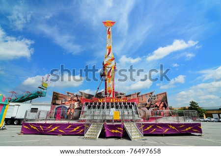 ATHENS, GEORGIA - MAY 3: The Ali Baba Amusement Ride is a gondola that swings 360 degrees and is present at many fairgrounds May 3, 2010 in Athens, Georgia.