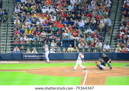 ATLANTA, GEORGIA - JUNE 16: Atlanta Braves batter swings against the Mets June 16, 2011 in Atlanta, Georgia.
