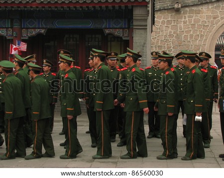YANQING, CHINA - MARCH 22: Chinese soldiers wait to ascend the Great Wall of China March 22, 2008 in Yanqing, China. Military service is compulsory in the People\'s Liberation Army.