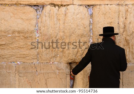 JERUSALEM - FEBRUARY 12: A hassidic Jew prays at the wailing wall in the Old City February 12, 2012 in Jerusalem, Israel. The wall is is one of the most sacred sites in Judaism.