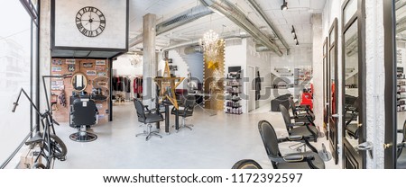 Panoramic view of a modern bright beauty salon. Hair salon and make up store, barber shop and manicure interior business