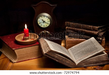 Still life with old books,Greek Gospel, clocks, candle and pipe