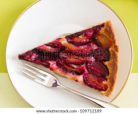 Delicious plum cake with organic plum, top view
