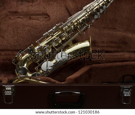 Vintage saxophone in it\'s original travel case.
