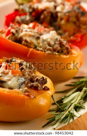 Baked stuffed red bell pepper filled with minced meat, onion, rice, tomato and green onion