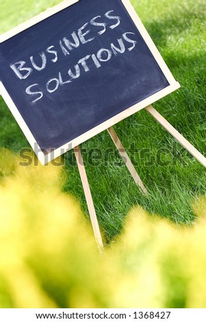 Chalkboard in the park with the sentence \
