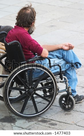 a disabled man begging on the street
