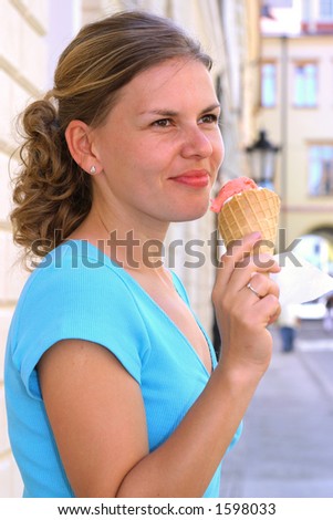 Blonde woman eating ice-cream.