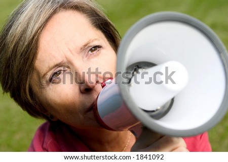 Woman talking through the megaphone.