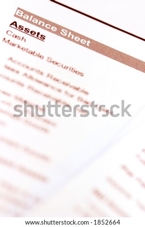 A macro shot of a balance sheet document. Focus on \