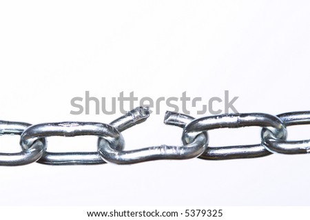Weak link in a chain, close-up with shallow depth of field.