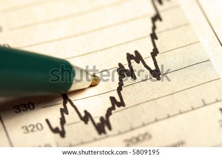 Pen pointing on the increasing graph