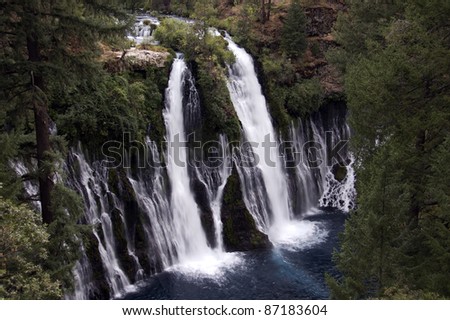 Waterfall: Evening above at the majestic 129 foot Burney Falls, located at McArthur Burney Falls Memorial State Park in Shasta County, California. Burney Creek flows from a natural spring.