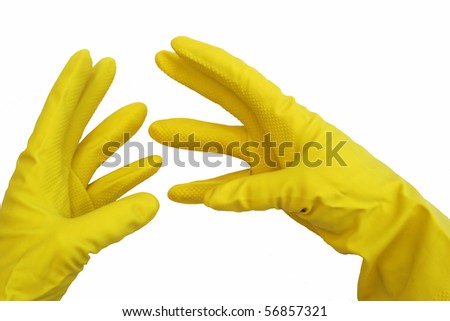 stock photo a pair of yellow rubber gloves on hands