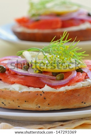 Smoked salmon lox with cream cheese capers and red onion on toasted poppy seed onion bagel