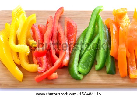 Sliced red, orange,green and yellow bell peppers ready for stir fry, appetizer, or salad