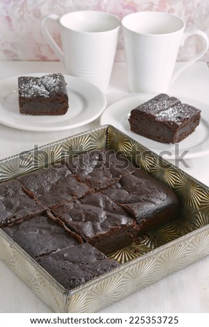 Extremely rich fudge chocolate brownies made without any grains, totally gluten free, in vertical format