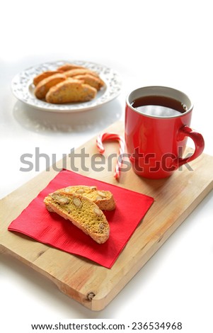 Fresh baked gluten free biscotti with tea in festive colors in vertical format