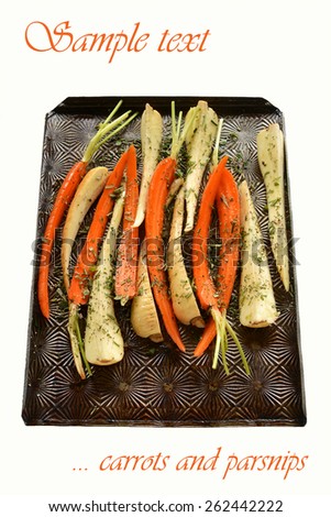 Carrots and parsnips prepared for roasting with olive oil and fresh chopped herbs in vertical format isolated on white background