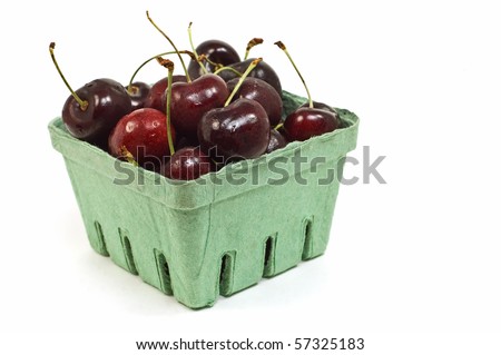 Dark red Bing or Lapin cherries isolated on white background in horizontal format with copy space